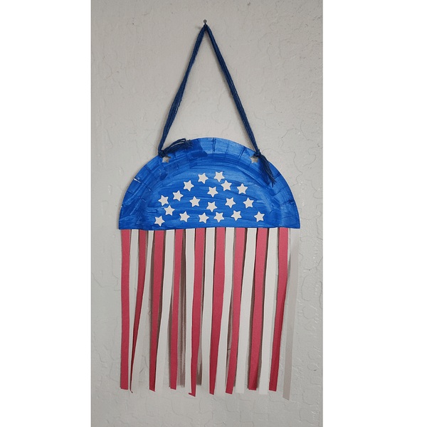 Make a banner, flag, or frame from construction paper and craft sticks.
